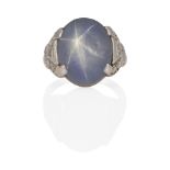 A PLATINUM, STAR SAPPHIRE AND DIAMOND RING