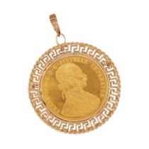 A 14K GOLD AND 24K GOLD COIN PENDANT