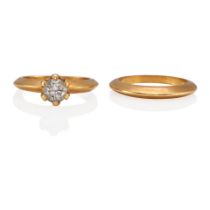AN 18K GOLD AND DIAMOND RING WITH AN 18K GOLD BAND