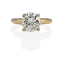 A 14K BI-COLOR GOLD AND DIAMOND SOLITAIRE RING