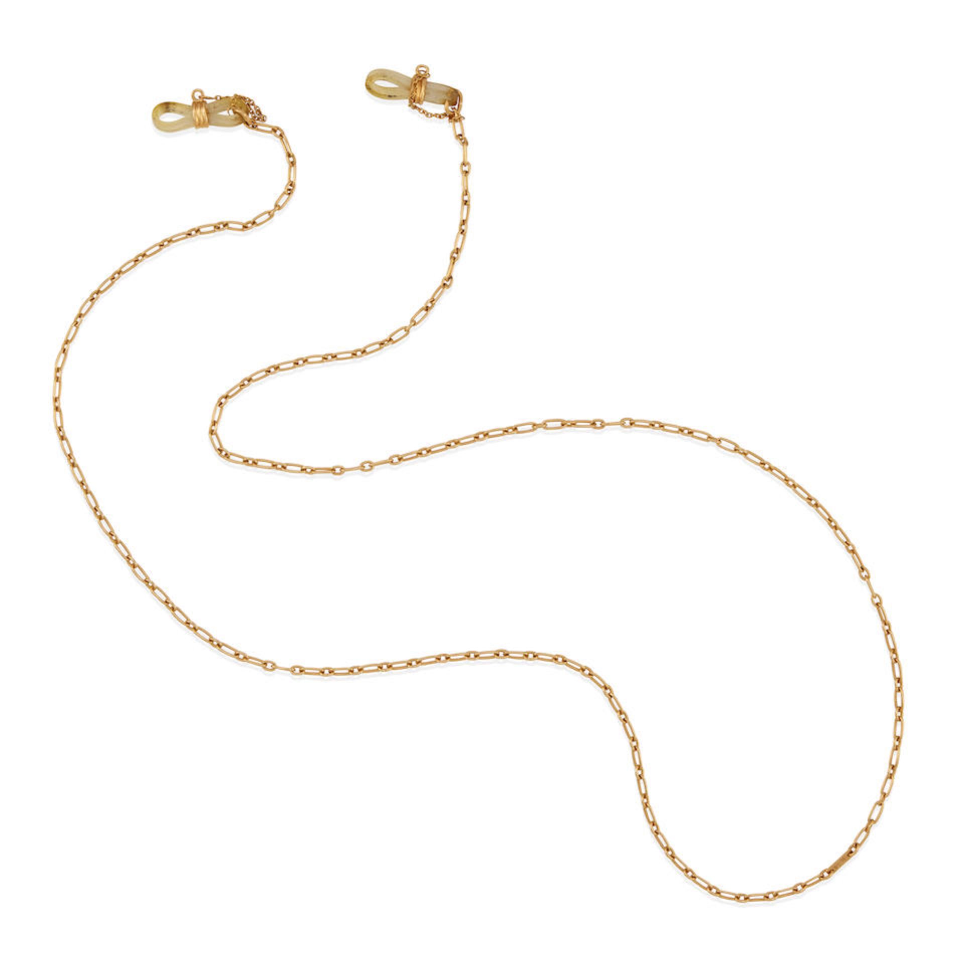 CARTIER: AN 18K GOLD GLASSES HOLDER CHAIN