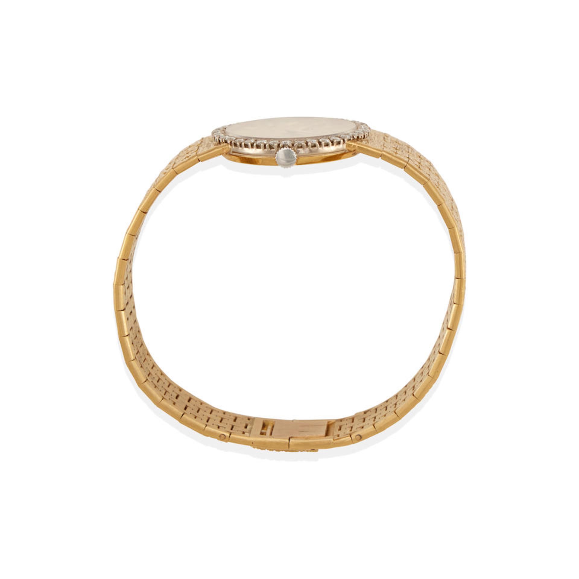 PIAGET: AN 18K BICOLOR YELLOW AND WHITE GOLD AND DIAMOND BRACELET-WRISTWATCH - Bild 2 aus 2