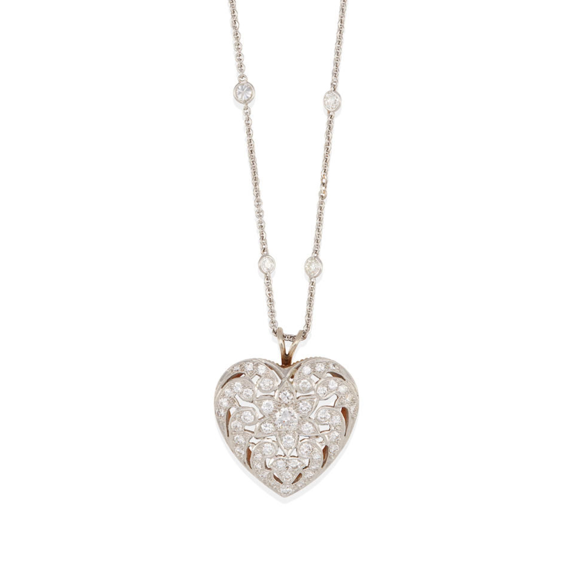 A PLATINUM AND DIAMOND HEART PENDANT NECKLACE