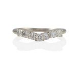 A 14K WHITE GOLD AND DIAMOND BAND