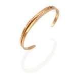 AN 18K GOLD AND DIAMOND CUFF BRACELET