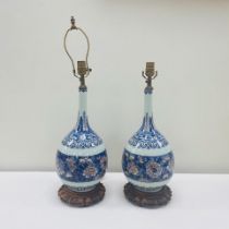 A PAIR OF CHINESE PORCELAIN BOTTLE-FORM VASES MOUNTED AS LAMPS