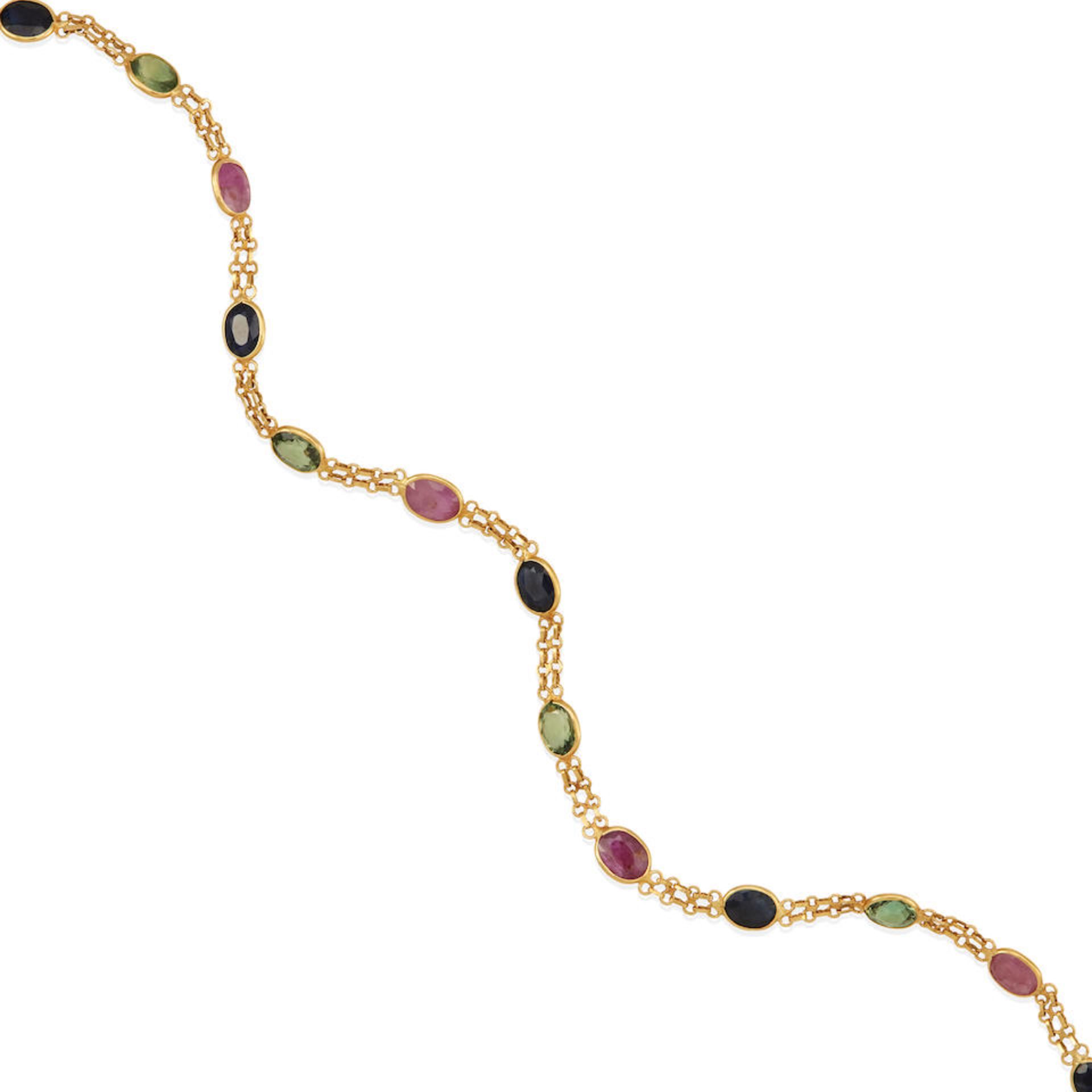 AN 18K GOLD, SAPPHIRE, AND RUBY BRACELET