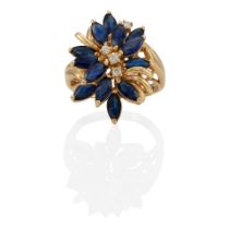 A 14K GOLD, SAPPHIRE AND DIAMOND RING