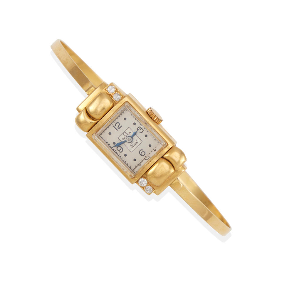 AN 18K GOLD BANGLE WRISTWATCH