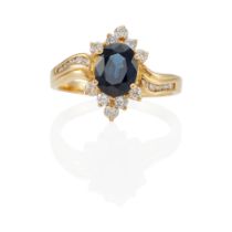 AN 18K GOLD, SAPPHIRE AND DIAMOND RING