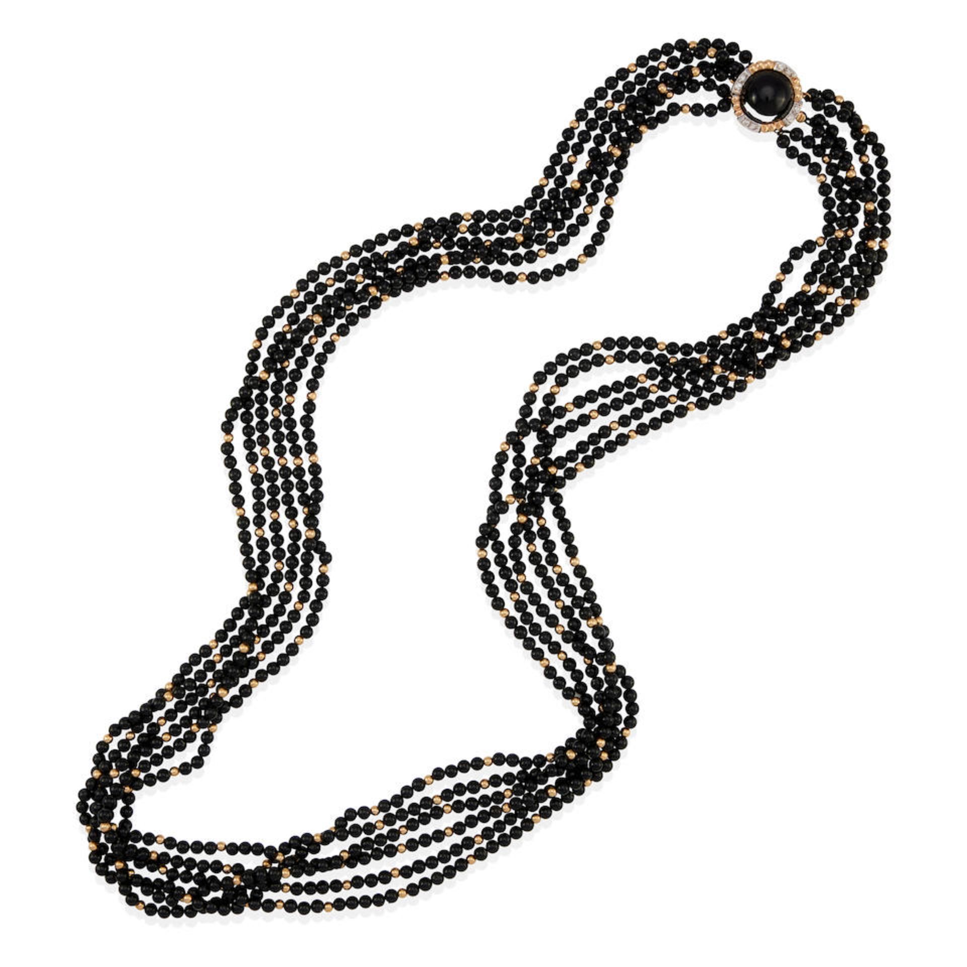 A 14K GOLD, ONYX AND DIAMOND NECKLACE