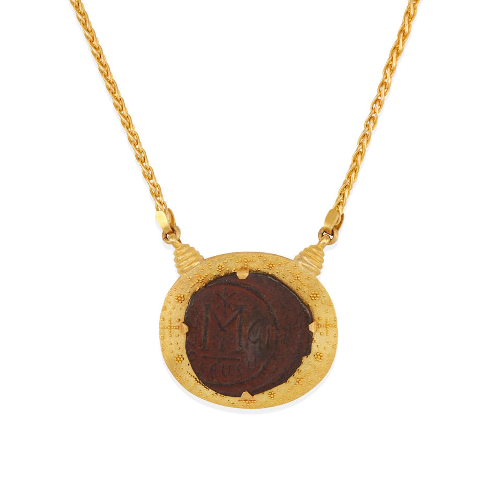 A GOLD AND COIN PENDANT NECKLACE