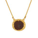 A GOLD AND COIN PENDANT NECKLACE