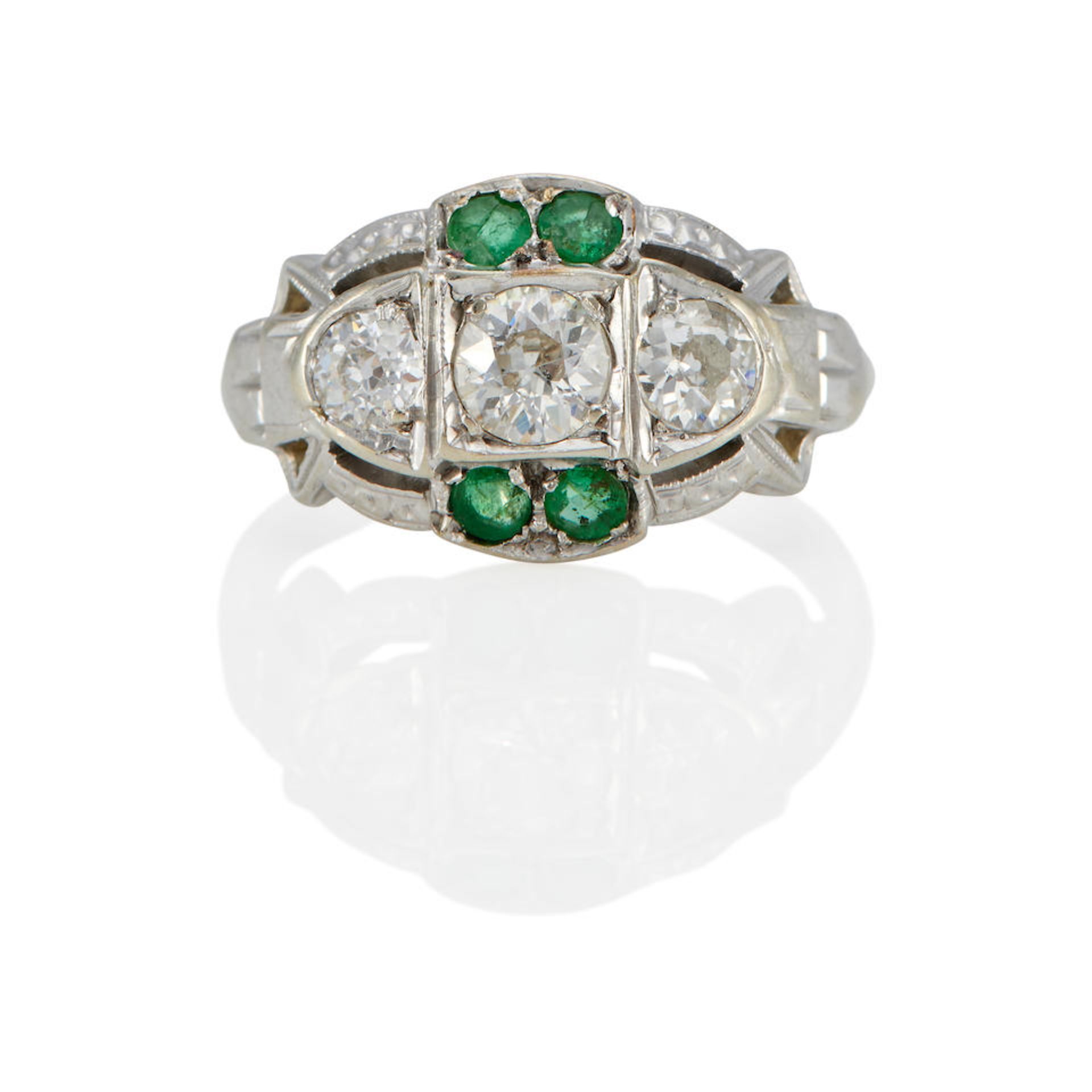 A 18K WHITE GOLD, EMERALD AND DIAMOND RING