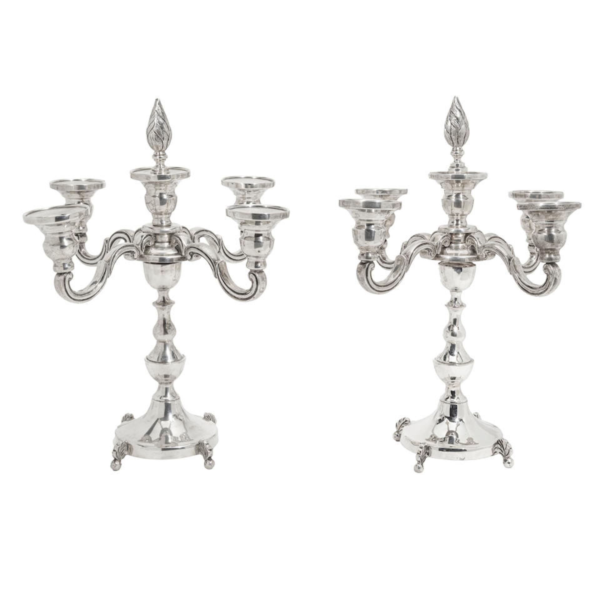 TWO SIMILAR STERLING SILVER WEIGHTED FIVE-LIGHT CANDELABRA one marked LM