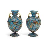 A PAIR OF MOSER ENAMELLED BLUE GLASS TWO-HANDLED FOOTED VASESEarly 20th century