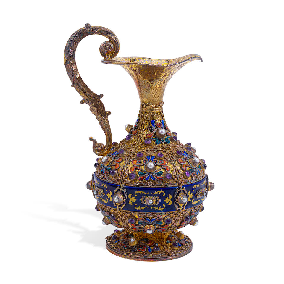 A HUNGARIAN SEMI-PRECIOUS GEMSTONE MOUNTED, ENAMEL, AND SILVER-GILT EWER Early 20th century