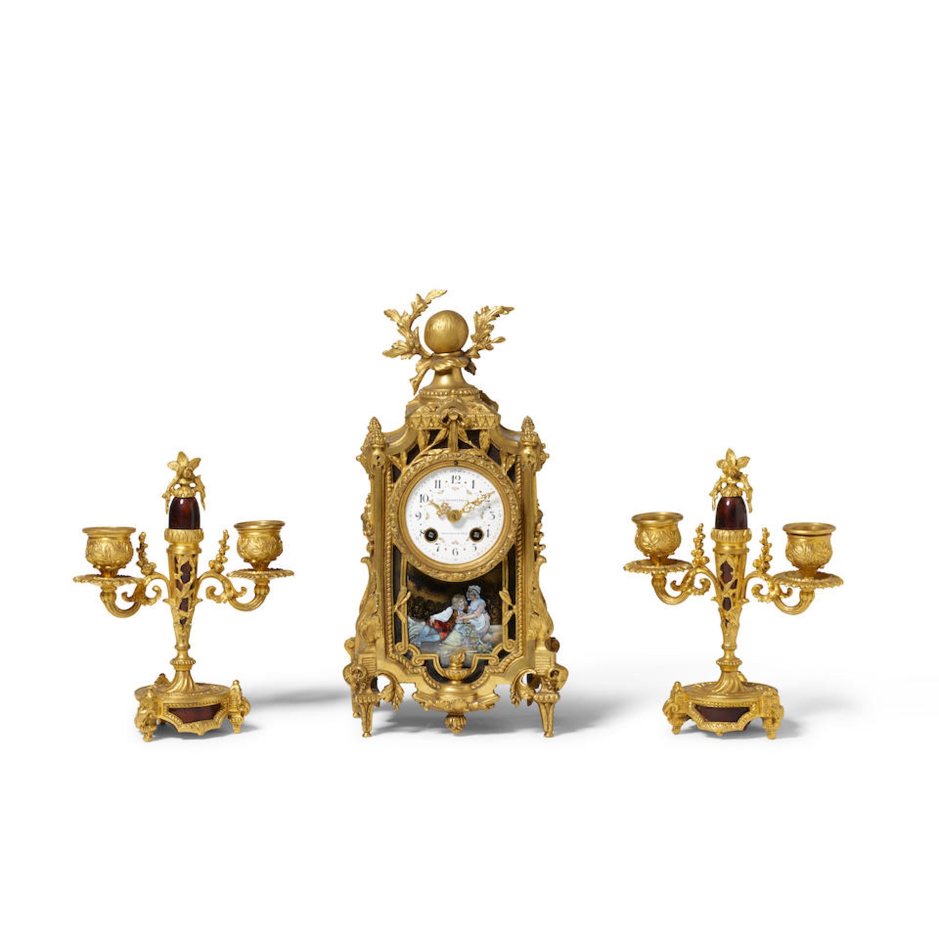 A LOUIS XVI STYLE GILT BRONZE AND ENAMEL THREE-PIECE CLOCK GARNITURE20th century