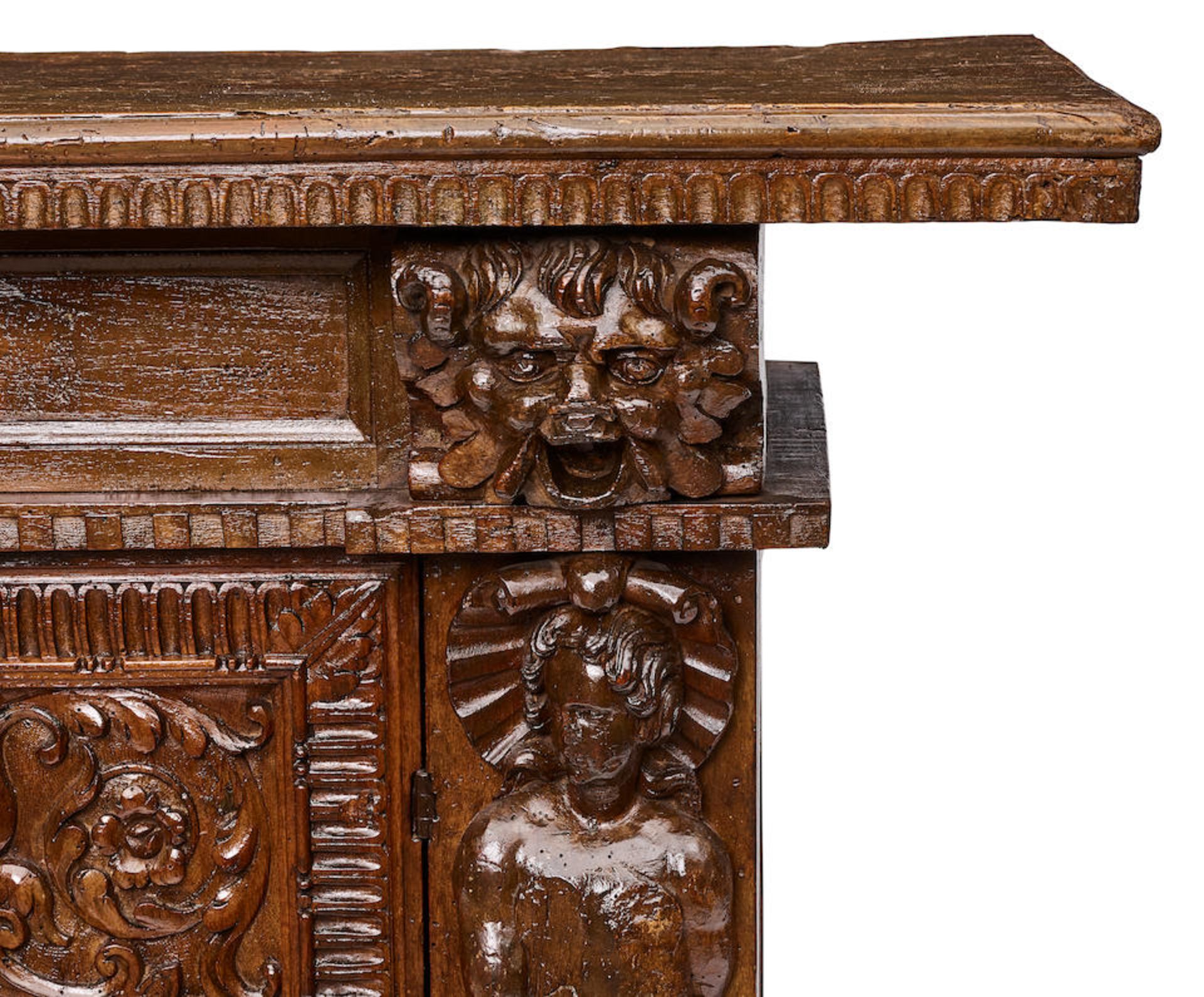 AN ITALIAN BAROQUE CARVED WALNUT CREDENZAEarly 17th century - Image 2 of 2