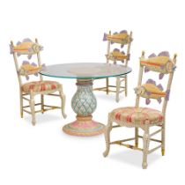A MACKENZIE-CHILDS DINING CERAMIC TABLE AND THREE PAINTED WOOD FISH CHAIRS