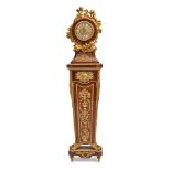 A LOUIS XVI STYLE GILT BRONZE MOUNTED TULIPWOOD, KINGWOOD, AND AMARANTH PEDESTAL CLOCKAfter the ...