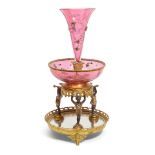 A MOSER GILT AND PATINATED METAL, GLASS, GILT AND ENAMELLED PINK GLASS EPERGNE1898-1915