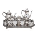 AN AMERICAN STERLING SILVER HAND-CHASED TEA AND COFFEE SERVICE by Tuttle Silver Co., Boston, Mas...