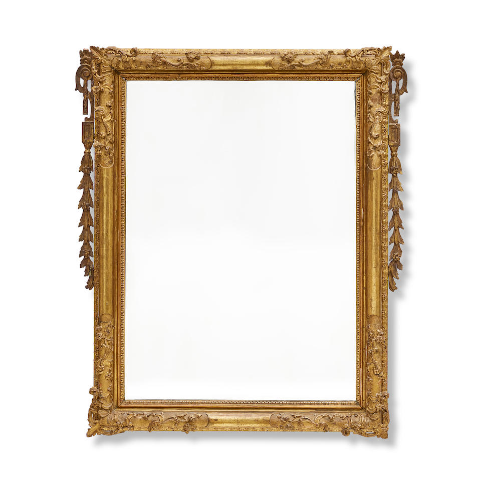 A VENETIAN CARVED GILTWOOD MIRROR18th century
