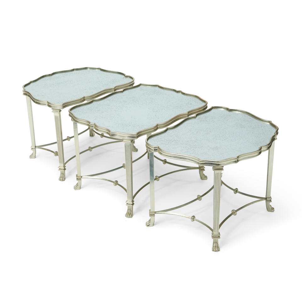 A REGENCY STYLE MIRRORED AND SILVERED METAL THREE-PIECE COFFEE TABLE20th century