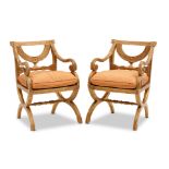 A PAIR OF REGENCY STYLE CARVED GILTWOOD ARMCHAIRS