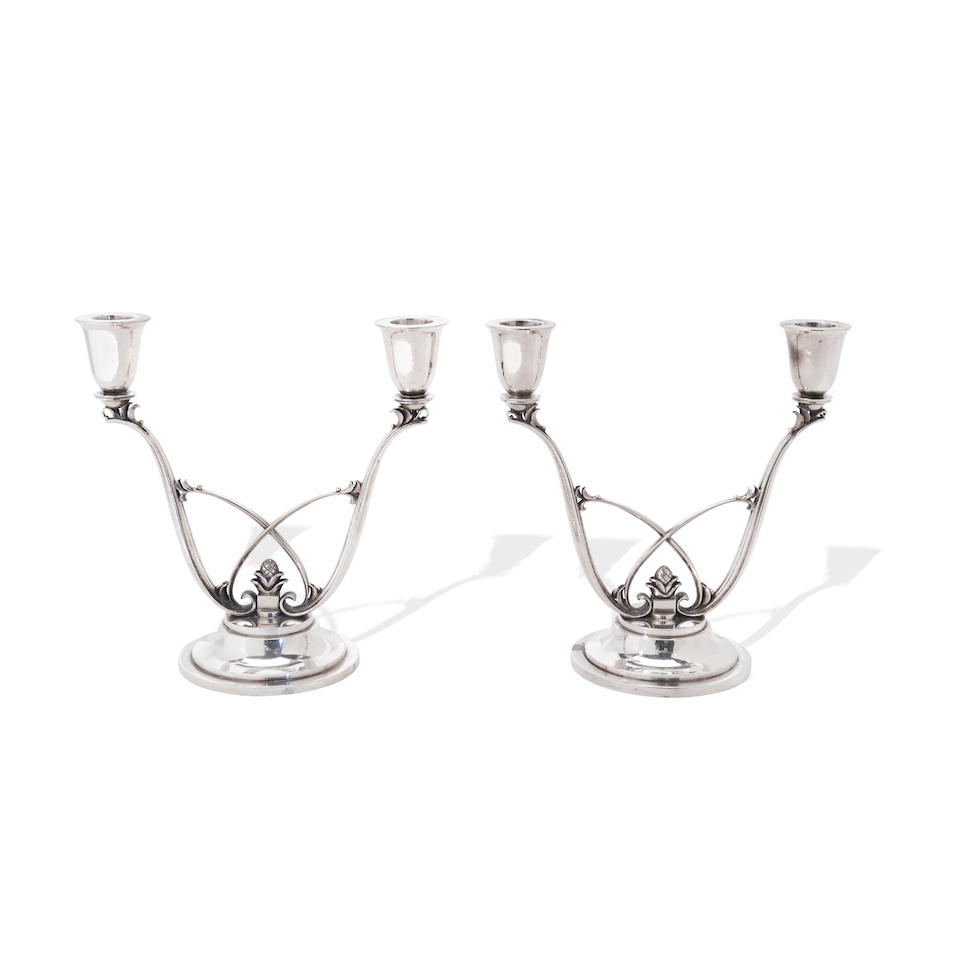 A PAIR OF DANISH STERLING SILVER TWO-LIGHT CANDELABRA designed by Harold Nielson (1892-1977) for...