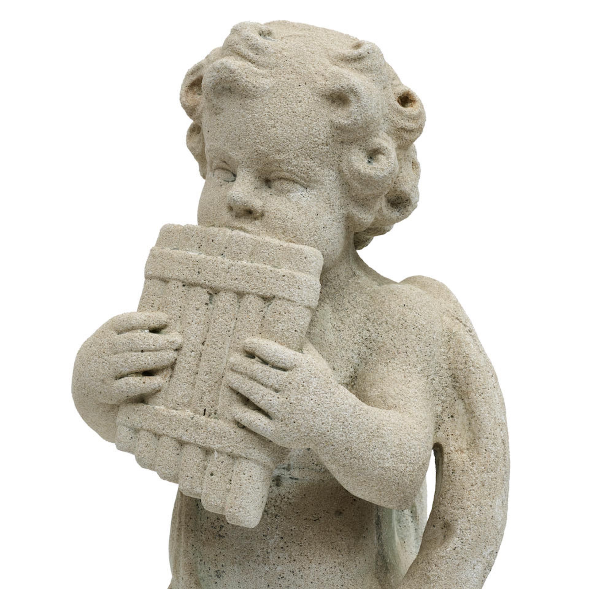 A PAIR OF CAST STONE GARDEN FIGURES OF PUTTI PLAYING INSTRUMENTS20th century - Image 2 of 2