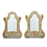 A MATCHED PAIR OF CONTINENTAL ROCOCO BLUE PAINTED AND PARCEL GILT MIRRORS Possibly German, in th...