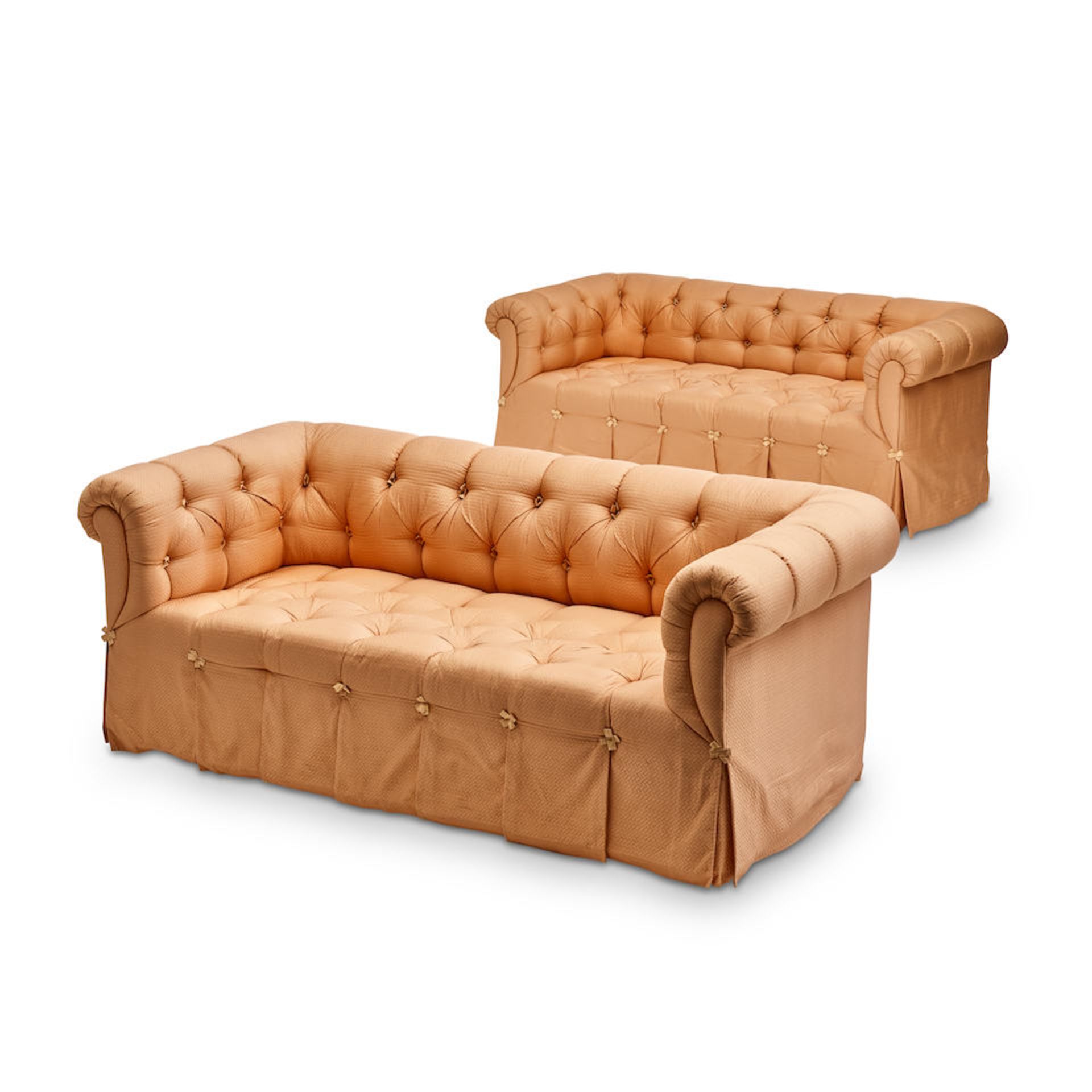 A PAIR OF CUSTOM CORAL TUFTED UPHOLSTERED SOFAS