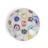 FRENCH GLASS PAPERWEIGHT WITH SILHOUETTE CANES ON UPSET MUSLIN GROUND, possibly Baccarat, late 1...