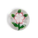 FRENCH GLASS PAPERWEIGHT WITH A SINGLE FLOWER, ht. 1 1/4, dia. 2 in.