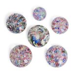 SIX END-OF-DAY MILLEFIORI SCRAMBLE GLASS PAPERWEIGHTS, France, ht. 1 1/2 to 2 1/4 in.