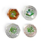 FOUR FACETED NOSEGAY GLASS PAPERWEIGHTS, paperweight with amber ground, ht. 2, white and pink no...