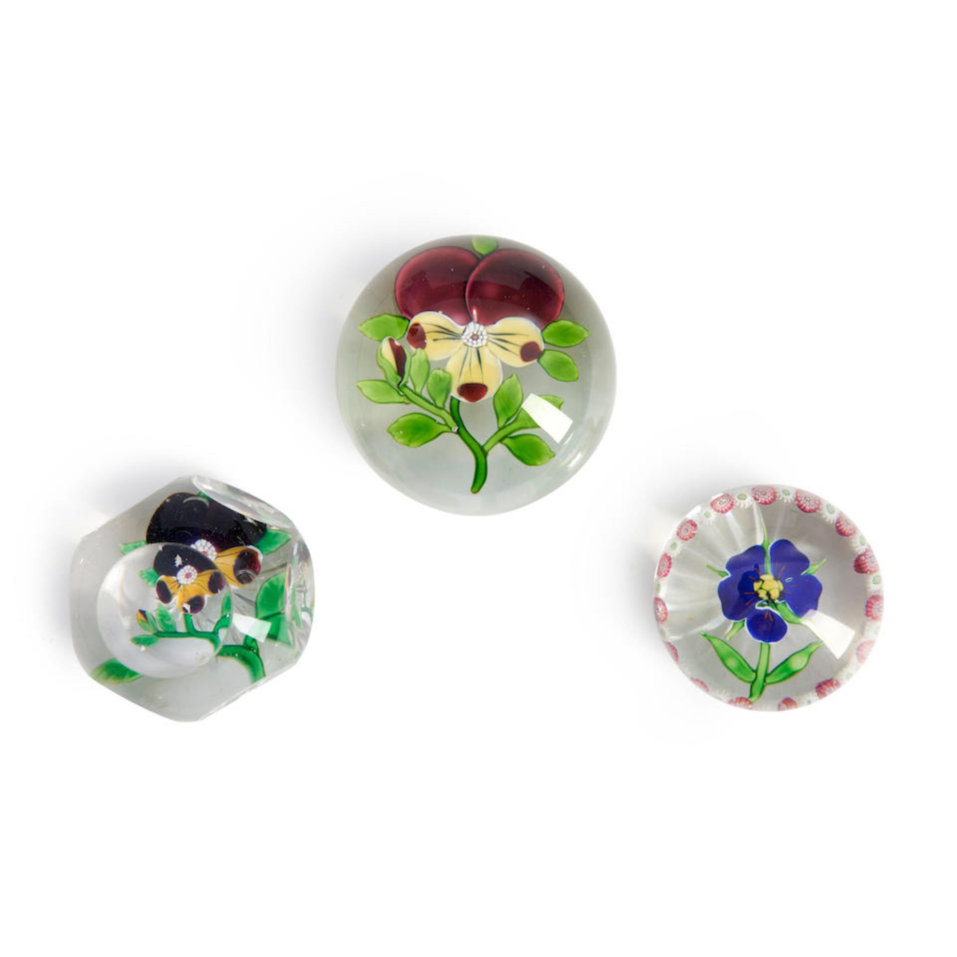 TWO PANSY AND A BLUE PELARGONIUM GLASS PAPERWEIGHTS, France, pansies ht. 1 3/4 to 2, pelargonium...