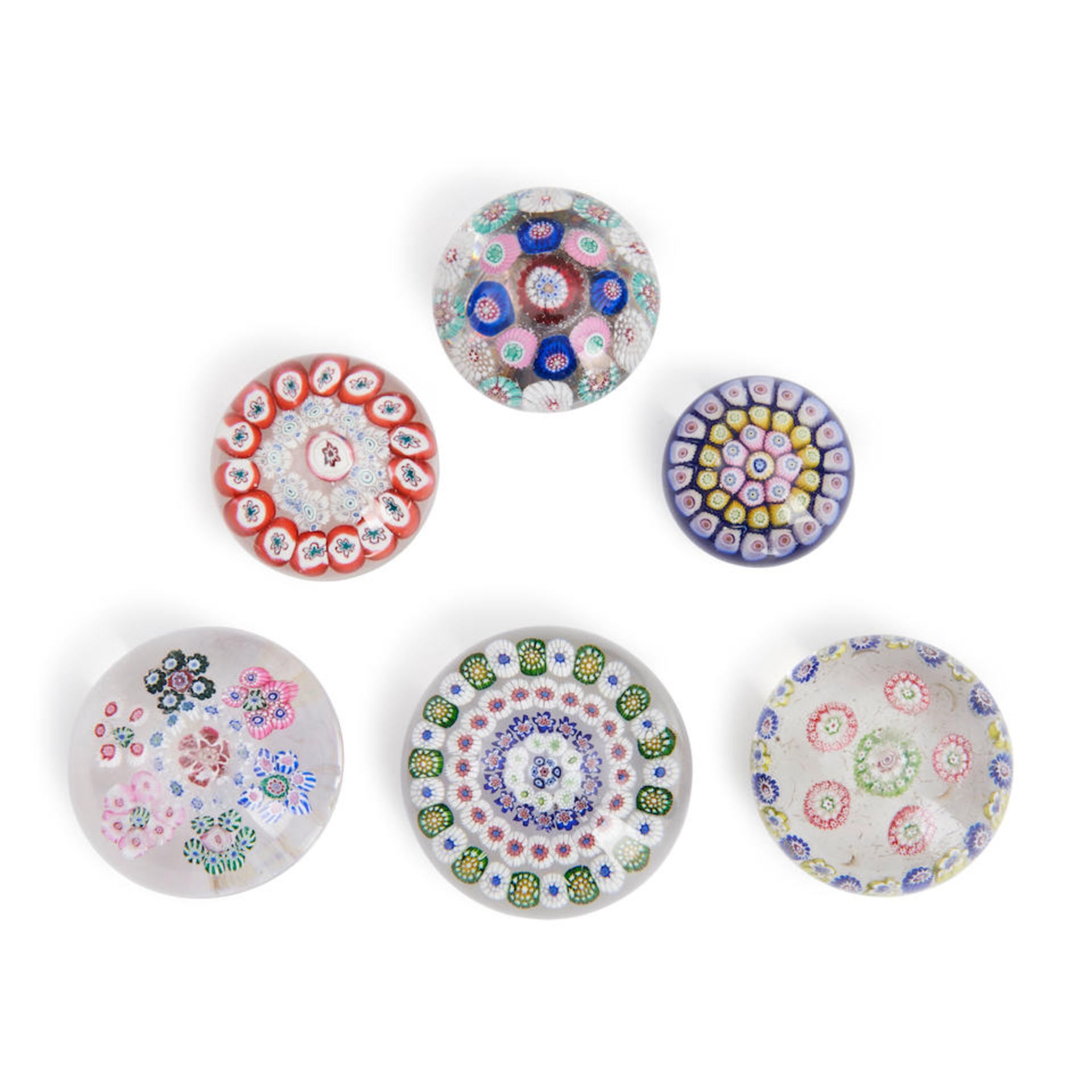 SIX SMALL MILLEFIORI GLASS PAPERWEIGHTS, including a metal based stopper, ht. 1/2 to 2 in.