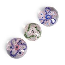 THREE ENTWINED GARLANDS MILLEFIORI GLASS PAPERWEIGHTS, France, paperweight with white and green ...