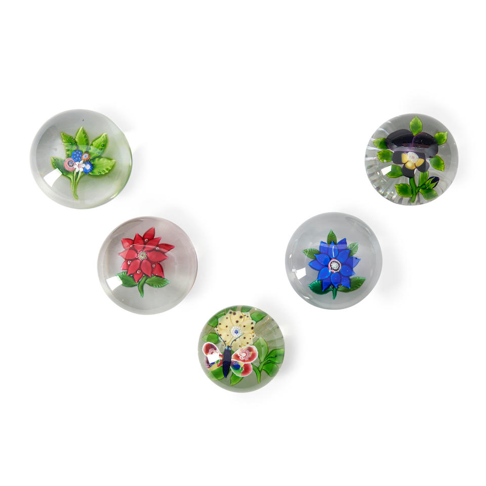 FIVE FLORAL GLASS PAPERWEIGHTS, including poinsettia, nosegay, clematis, pansy, and butterfly wi...