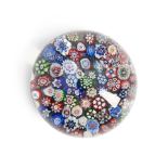 BACCARAT CLOSE-PACKED MILLEFIORI PAPERWEIGHT, France, late 19th century, ht. 2, dia. 2 1/2 in.