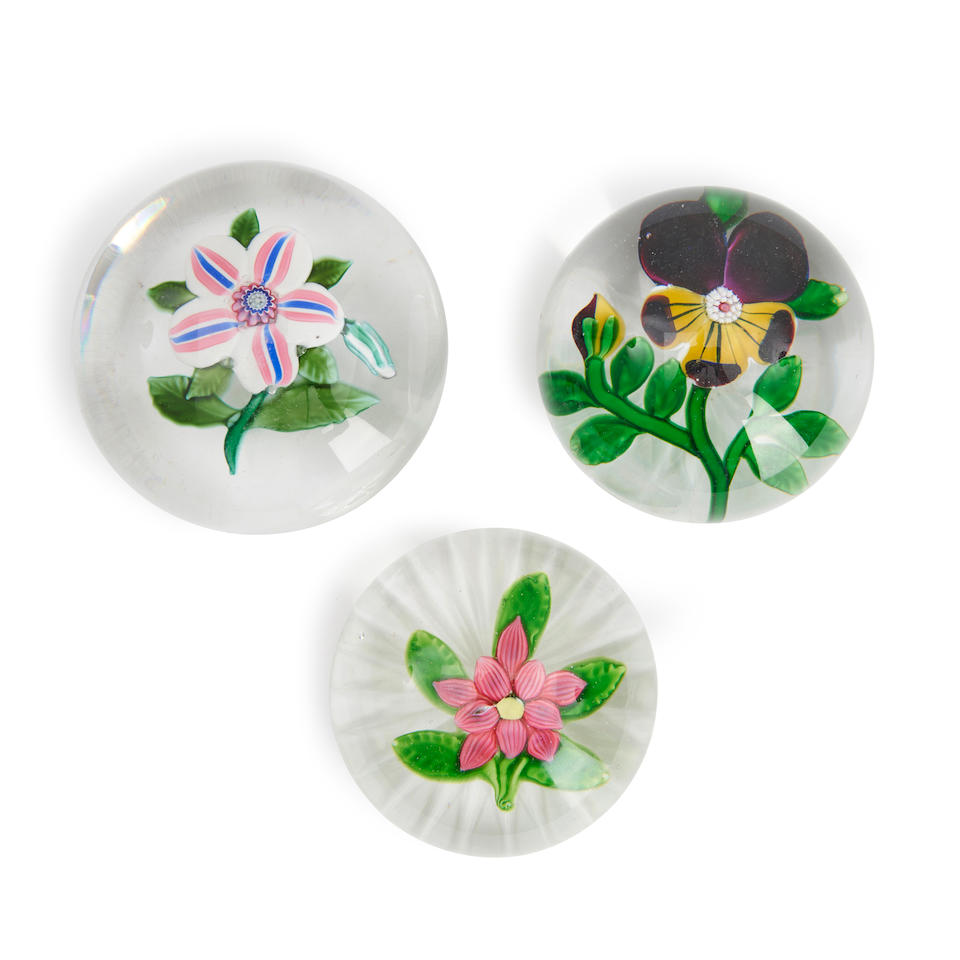 THREE FLORAL GLASS PAPERWEIGHTS, pansy, ht. 1 3/4, dia. 2 1/2, multicolor flower with bud, ht. 1...