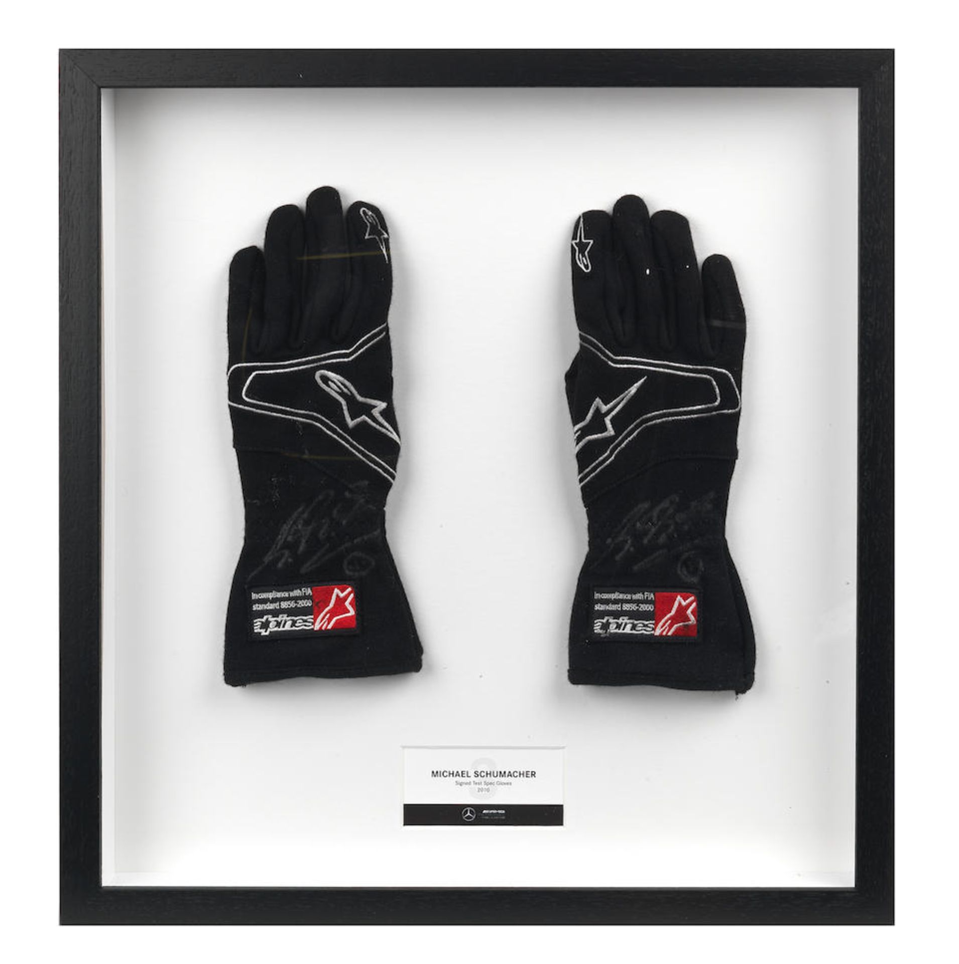 A signed pair of Michael Schumacher Mercedes AMG Petronas F1 2010 test spec gloves,