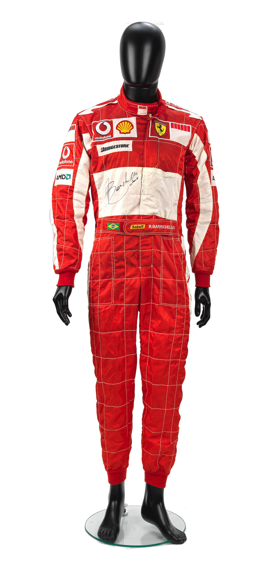 A signed set of used Rubens Barrichello Scuderia Ferrari Marlboro race overalls by Puma from the...