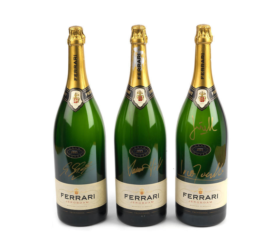 Three signed Ferrari champagne bottles, ((3))