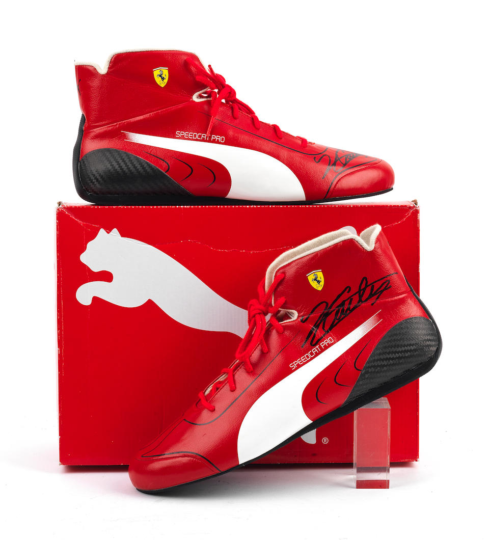 An official pair of Ferrari Speedcat Pro CS Replica race boots signed by Charles Leclerc,