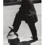 Leon Levinstein (1910-1988); NYC [man resting his foot on a fire hydrant];