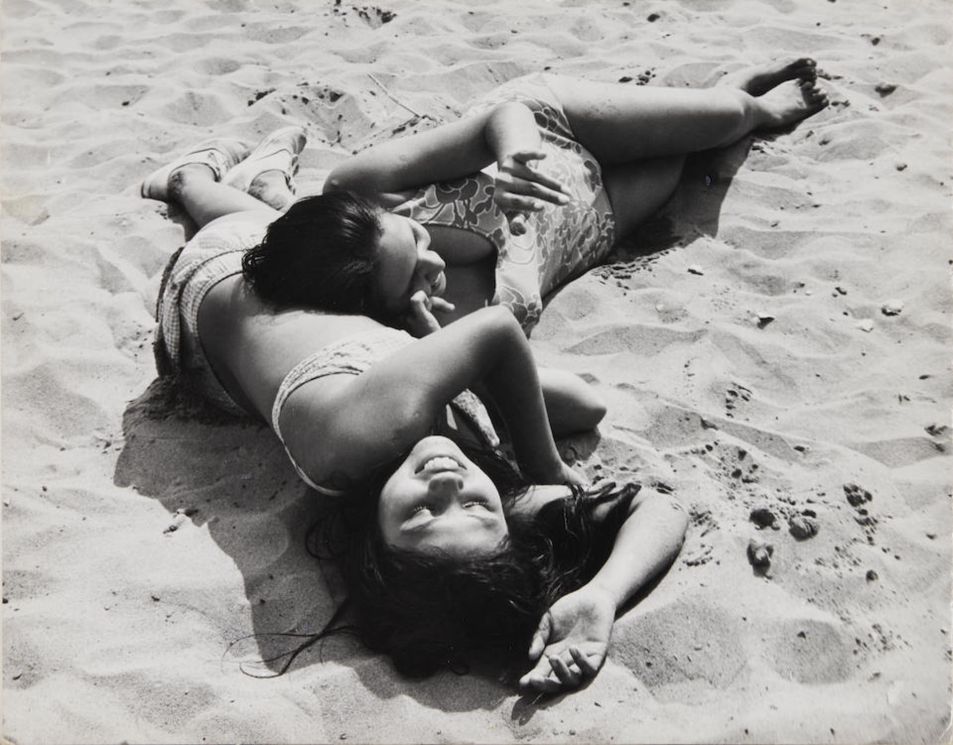 Leon Levinstein (1910-1988); Untitled [two girls lying on the beach, Coney Island, Brooklyn];